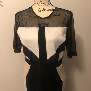 Used medium firm fitting dress with detail.